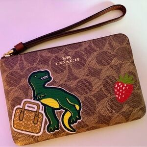 NWT Coach Signature Dinosaur Zip Wristlet